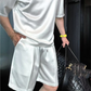 Conjunto casual de dos piezas de top y pantalones cortos lisos para hombre