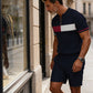 Set de camiseta y pantalones cortos con cremallera cuarta de hombre